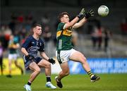 22 June 2025; Ben Kelleher of Kerry in action against Cahair Tighe of Mayo during the Electric Ireland GAA Football All-Ireland Minor Championship semi-final match between Kerry and Mayo at Zimmer Biomet Páirc Chíosóg in Ennis, Clare. Photo by Brendan Moran/Sportsfile