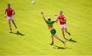 22 June 2025; Paul Matthews of Louth in action against Oisin Gallen of Donegal during the GAA Football All-Ireland Senior Championship preliminary quarter-final match between Donegal and Louth at MacCumhaill Park in Ballybofey, Donegal. Photo by Ramsey Cardy/Sportsfile
