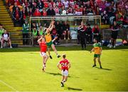 22 June 2025; Ciaran Thompson of Donegal in action against Tommy Durnin of Louth during the GAA Football All-Ireland Senior Championship preliminary quarter-final match between Donegal and Louth at MacCumhaill Park in Ballybofey, Donegal. Photo by Ramsey Cardy/Sportsfile