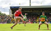 22 June 2025; Peter Lynch of Louth and Finnbarr Roarty of Donegal during the GAA Football All-Ireland Senior Championship preliminary quarter-final match between Donegal and Louth at MacCumhaill Park in Ballybofey, Donegal. Photo by Ramsey Cardy/Sportsfile
