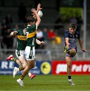 22 June 2025; Dara Flanagan of Mayo kicks a point despite the efforts of David Sargent and Marcus Clifford of Kerry  during the Electric Ireland GAA Football All-Ireland Minor Championship semi-final match between Kerry and Mayo at Zimmer Biomet Páirc Chíosóg in Ennis, Clare. Photo by Brendan Moran/Sportsfile