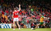 22 June 2025; Michael Murphy of Donegal kicks a free under pressure from Sam Mulroy of Louth during the GAA Football All-Ireland Senior Championship preliminary quarter-final match between Donegal and Louth at MacCumhaill Park in Ballybofey, Donegal. Photo by Ramsey Cardy/Sportsfile