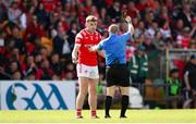 22 June 2025; Peter Lynch of Louth is shown a black card by referee Barry Cassidy during the GAA Football All-Ireland Senior Championship preliminary quarter-final match between Donegal and Louth at MacCumhaill Park in Ballybofey, Donegal. Photo by Ramsey Cardy/Sportsfile