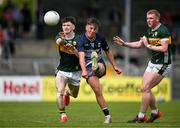 22 June 2025; Dara Flanagan of Mayo in action against David Sargent and John Curtin of Kerry during the Electric Ireland GAA Football All-Ireland Minor Championship semi-final match between Kerry and Mayo at Zimmer Biomet Páirc Chíosóg in Ennis, Clare. Photo by Brendan Moran/Sportsfile