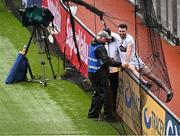 22 June 2025; Kevin Flynn of Kildare gets help from TV camera operator Joe O'Byrne and umpire Fergal McCrory to get free from the ball-stopper net behind the goals after chasing a loose ball during the Tailteann Cup semi-final match between Kildare and Fermanagh at Croke Park in Dublin. Photo by Piaras Ó Mídheach/Sportsfile