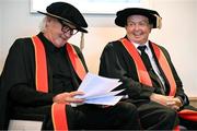 23 June 2025; Irish sports broadcaster Marty Morrissey, right, and singer Johnny Logan, formally known as Sean Patrick Sherrard, share a joke as they receive their honorary doctorial awards at the Longford International College Graduation Ceremony 2025 at the Radisson Blu Dublin Airport Hotel in Dublin. Photo by Shauna Clinton/Sportsfile