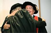 23 June 2025; Irish sports broadcaster Marty Morrissey, right, and singer Johnny Logan, formally known as Sean Patrick Sherrard, hug as they receive their honorary doctorial awards at the Longford International College Graduation Ceremony 2025 at the Radisson Blu Dublin Airport Hotel in Dublin. Photo by Shauna Clinton/Sportsfile