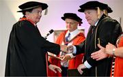 23 June 2025; Irish sports broadcaster Marty Morrissey, left, as he receives his honorary doctorial award at the Longford International College Graduation Ceremony 2025 at the Radisson Blu Dublin Airport Hotel in Dublin. Photo by Shauna Clinton/Sportsfile