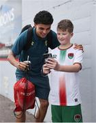23 June 2025; Freddie Anderson of Cork City has his photo taken with a supporter before the SSE Airtricity Men's Premier Division match between Cork City and Drogheda United at Turner's Cross in Cork. Photo by Thomas Flinkow/Sportsfile