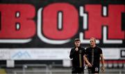 23 June 2025; Bohemians players John Mountney, right, and James McManus walk the pitch before the SSE Airtricity Men's Premier Division match between Bohemians and Shamrock Rovers at Dalymount Park in Dublin. Photo by Shauna Clinton/Sportsfile