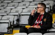 23 June 2025; A Bohemians supporter enjoys some chips before the SSE Airtricity Men's Premier Division match between Bohemians and Shamrock Rovers at Dalymount Park in Dublin. Photo by Shauna Clinton/Sportsfile