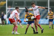 22 June 2025; Dara Curran of Roscommon in action against Tyrone players James Daly, left, and Pádraig Donaghy during the Electric Ireland GAA Football All-Ireland Minor Championship semi-final match between Tyrone and Roscommon at Kingspan Breffni in Cavan. Photo by Seb Daly/Sportsfile