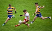 22 June 2025; Joel Kerr of Tyrone in action against Roscommon players Christopher Feerick, left, and Conor Tighe during the Electric Ireland GAA Football All-Ireland Minor Championship semi-final match between Tyrone and Roscommon at Kingspan Breffni in Cavan. Photo by Seb Daly/Sportsfile
