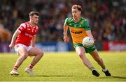 22 June 2025; Ciaran Thompson of Donegal in action against Daire Nally of Louth during the GAA Football All-Ireland Senior Championship preliminary quarter-final match between Donegal and Louth at MacCumhaill Park in Ballybofey, Donegal. Photo by Ramsey Cardy/Sportsfile