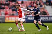23 June 2025; Zach Elbouzedi of St Patrick's Athletic in action against Carl Winchester of Derry City during the SSE Airtricity Men's Premier Division match between St Patrick's Athletic and Derry City at Richmond Park in Dublin. Photo by Ben McShane/Sportsfile