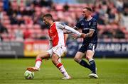23 June 2025; Zach Elbouzedi of St Patrick's Athletic in action against Carl Winchester of Derry City during the SSE Airtricity Men's Premier Division match between St Patrick's Athletic and Derry City at Richmond Park in Dublin. Photo by Ben McShane/Sportsfile