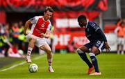 23 June 2025; Axel Sjoberg of St Patrick's Athletic in action against Sadou Diallo of Derry City during the SSE Airtricity Men's Premier Division match between St Patrick's Athletic and Derry City at Richmond Park in Dublin. Photo by Ben McShane/Sportsfile