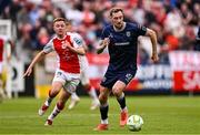 23 June 2025; Kevin Holt of Derry City in action against Brandon Kavanagh of St Patrick's Athletic during the SSE Airtricity Men's Premier Division match between St Patrick's Athletic and Derry City at Richmond Park in Dublin. Photo by Ben McShane/Sportsfile