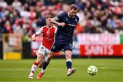 23 June 2025; Kevin Holt of Derry City in action against Brandon Kavanagh of St Patrick's Athletic during the SSE Airtricity Men's Premier Division match between St Patrick's Athletic and Derry City at Richmond Park in Dublin. Photo by Ben McShane/Sportsfile