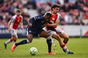 23 June 2025; Sadou Diallo of Derry City is tackled by Simon Power of St Patrick's Athletic during the SSE Airtricity Men's Premier Division match between St Patrick's Athletic and Derry City at Richmond Park in Dublin. Photo by Ben McShane/Sportsfile