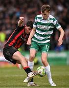 23 June 2025; James Clarke of Bohemians in action against Matt Healy of Shamrock Rovers during the SSE Airtricity Men's Premier Division match between Bohemians and Shamrock Rovers at Dalymount Park in Dublin. Photo by Ramsey Cardy/Sportsfile