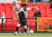 23 June 2025; Conor Kane of Drogheda United is tackled by Milan Mbeng of Cork City during the SSE Airtricity Men's Premier Division match between Cork City and Drogheda United at Turner's Cross in Cork. Photo by Thomas Flinkow/Sportsfile