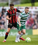 23 June 2025; Jack Byrne of Shamrock Rovers in action against Adam McDonnell of Bohemians during the SSE Airtricity Men's Premier Division match between Bohemians and Shamrock Rovers at Dalymount Park in Dublin. Photo by Shauna Clinton/Sportsfile