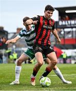 23 June 2025; James Clarke of Bohemians in action against Matt Healy of Shamrock Rovers during the SSE Airtricity Men's Premier Division match between Bohemians and Shamrock Rovers at Dalymount Park in Dublin. Photo by Shauna Clinton/Sportsfile