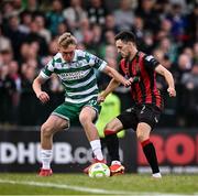 23 June 2025; Michael Noonan of Shamrock Rovers in action against Liam Smith of Bohemians during the SSE Airtricity Men's Premier Division match between Bohemians and Shamrock Rovers at Dalymount Park in Dublin. Photo by Ramsey Cardy/Sportsfile