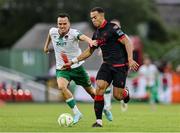 23 June 2025; Aaron Harper-Bailey of Drogheda United in action against Alex Nolan of Cork City during the SSE Airtricity Men's Premier Division match between Cork City and Drogheda United at Turner's Cross in Cork. Photo by Thomas Flinkow/Sportsfile