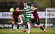 23 June 2025; Jack Byrne of Shamrock Rovers in action against Adam McDonnell of Bohemians during the SSE Airtricity Men's Premier Division match between Bohemians and Shamrock Rovers at Dalymount Park in Dublin. Photo by Ramsey Cardy/Sportsfile