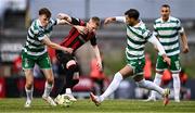 23 June 2025; Ross Tierney of Bohemians in action against Matt Healy, left, and Danny Mandroiu of Shamrock Rovers during the SSE Airtricity Men's Premier Division match between Bohemians and Shamrock Rovers at Dalymount Park in Dublin. Photo by Ramsey Cardy/Sportsfile