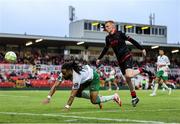 23 June 2025; Milan Mbeng of Cork City in action against Shane Farrell of Drogheda United during the SSE Airtricity Men's Premier Division match between Cork City and Drogheda United at Turner's Cross in Cork. Photo by Thomas Flinkow/Sportsfile