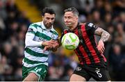 23 June 2025; Rob Cornwall of Bohemians in action against Danny Mandroiu of Shamrock Rovers during the SSE Airtricity Men's Premier Division match between Bohemians and Shamrock Rovers at Dalymount Park in Dublin. Photo by Shauna Clinton/Sportsfile