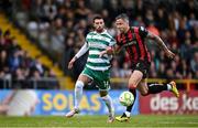 23 June 2025; Rob Cornwall of Bohemians in action against Danny Mandroiu of Shamrock Rovers during the SSE Airtricity Men's Premier Division match between Bohemians and Shamrock Rovers at Dalymount Park in Dublin. Photo by Shauna Clinton/Sportsfile