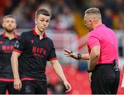 23 June 2025; Referee Alan Patchell speaks to Warren Davis of Drogheda United during the SSE Airtricity Men's Premier Division match between Cork City and Drogheda United at Turner's Cross in Cork. Photo by Thomas Flinkow/Sportsfile