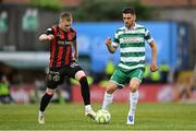 23 June 2025; Lee Grace of Shamrock Rovers in action against Ross Tierney of Bohemians during the SSE Airtricity Men's Premier Division match between Bohemians and Shamrock Rovers at Dalymount Park in Dublin. Photo by Shauna Clinton/Sportsfile