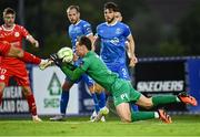 23 June 2025; Waterford goalkeeper Stephen McMullan makes a save as he is challenged by the boot of Ellis Chapman of Shelbourne during the SSE Airtricity Men's Premier Division match between Waterford and Shelbourne at the Regional Sports Centre in Waterford. Photo by Piaras Ó Mídheach/Sportsfile