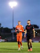 23 June 2025; A dejected Drogheda United goalkeeper Luke Dennison, left, leaves the pitch after the SSE Airtricity Men's Premier Division match between Cork City and Drogheda United at Turner's Cross in Cork. Photo by Thomas Flinkow/Sportsfile