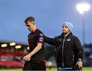 23 June 2025; A dejected Warren Davis of Drogheda United is consoled by strength and conditioning coach Conor Tully after the SSE Airtricity Men's Premier Division match between Cork City and Drogheda United at Turner's Cross in Cork. Photo by Thomas Flinkow/Sportsfile