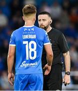 23 June 2025; Referee Declan Toland with Tommy Lonergan of Waterford during the SSE Airtricity Men's Premier Division match between Waterford and Shelbourne at the Regional Sports Centre in Waterford. Photo by Piaras Ó Mídheach/Sportsfile