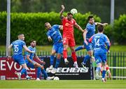 23 June 2025; Paddy Barrett of Shelbourne wins a header against Rowan McDonald, left, and Ryan Burke of Waterford during the SSE Airtricity Men's Premier Division match between Waterford and Shelbourne at the Regional Sports Centre in Waterford. Photo by Piaras Ó Mídheach/Sportsfile