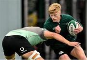 24 June 2025; Tommy O’Brien is tackled by Max Deegan during the Ireland rugby squad training at the IRFU High Performance Centre at the Sport Ireland Campus in Dublin. Photo by Brendan Moran/Sportsfile