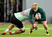 24 June 2025; Tommy O’Brien is tackled by Max Deegan during the Ireland rugby squad training at the IRFU High Performance Centre at the Sport Ireland Campus in Dublin. Photo by Brendan Moran/Sportsfile