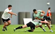 24 June 2025; Cormac Izuchukwu is tackled by Paddy McCarthy during the Ireland rugby squad training at the IRFU High Performance Centre at the Sport Ireland Campus in Dublin. Photo by Brendan Moran/Sportsfile