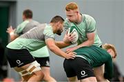 24 June 2025; Ciaran Frawley is tackled by Max Deegan and Tommy O’Brien during the Ireland rugby squad training at the IRFU High Performance Centre at the Sport Ireland Campus in Dublin. Photo by Brendan Moran/Sportsfile