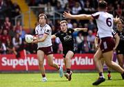 22 June 2025; Paul Conroy of Galway and Ryan Magill of Down during the GAA Football All-Ireland Senior Championship preliminary quarter-final match between Down and Galway at Páirc Esler in Newry, Down. Photo by Ben McShane/Sportsfile