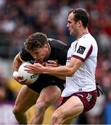 22 June 2025; Pierce Laverty of Down is tackled by John Maher of Galway during the GAA Football All-Ireland Senior Championship preliminary quarter-final match between Down and Galway at Páirc Esler in Newry, Down. Photo by Ben McShane/Sportsfile