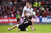 22 June 2025; Cein Darcy of Galway gets a pass away from Miceal Rooney of Down during the GAA Football All-Ireland Senior Championship preliminary quarter-final match between Down and Galway at Páirc Esler in Newry, Down. Photo by Ben McShane/Sportsfile