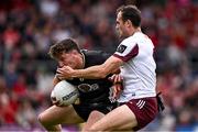 22 June 2025; Pierce Laverty of Down is tackled by John Maher of Galway during the GAA Football All-Ireland Senior Championship preliminary quarter-final match between Down and Galway at Páirc Esler in Newry, Down. Photo by Ben McShane/Sportsfile